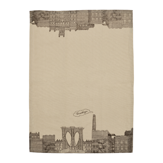 Full view of the Brooklyn tea towel featuring illustrated bridge and building details, a practical kitchen towel with classic NYC character