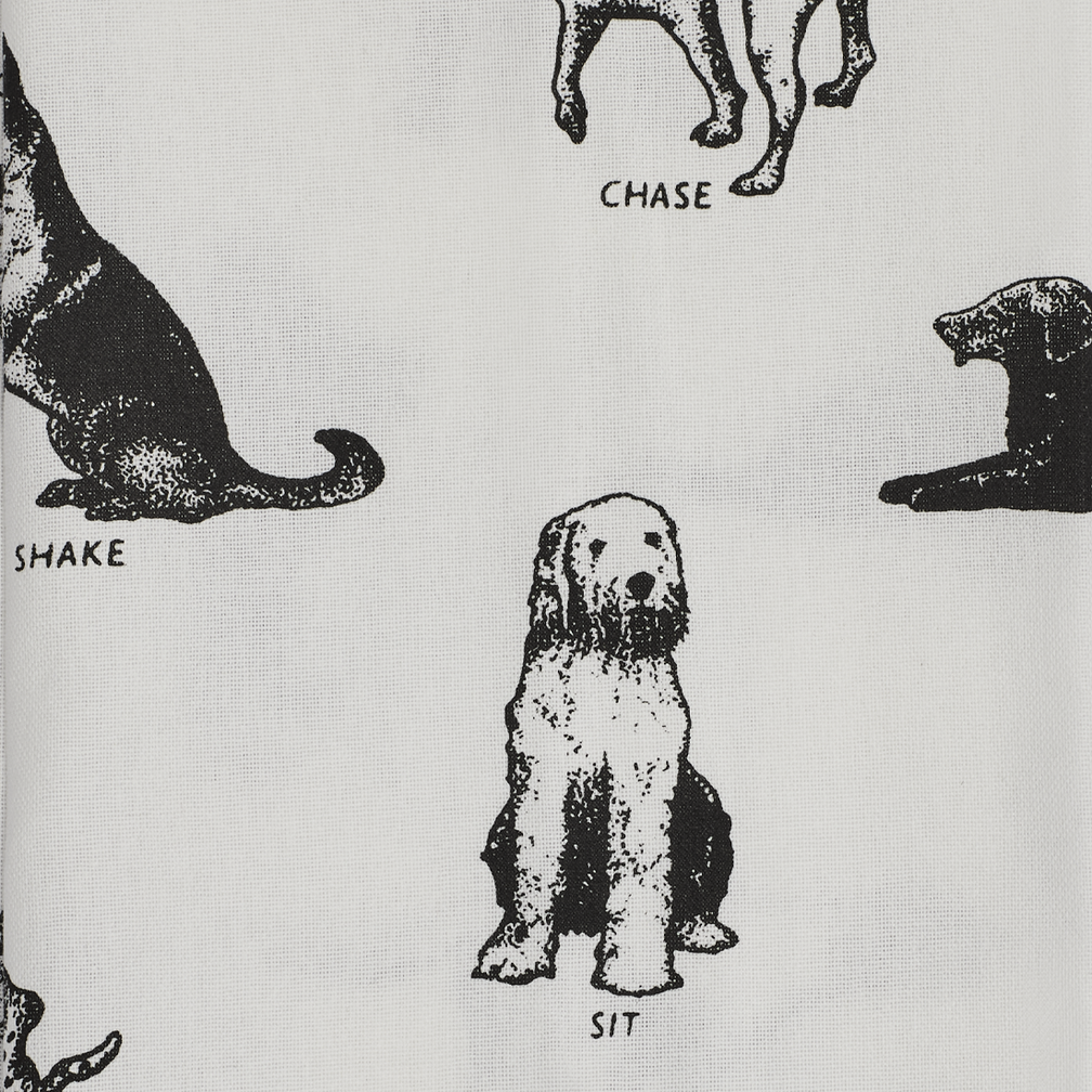 Dog Tricks Tea Towel with playful dog inspired illustration, ideal for enhancing colorful table settings and casual entertaining