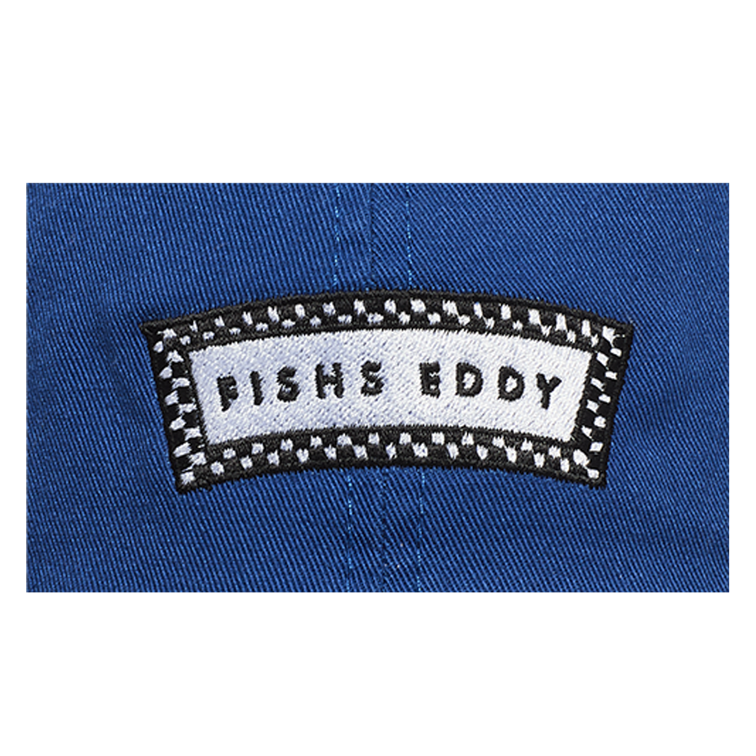 Patch with 'FISHS EDDY' text on a blue background