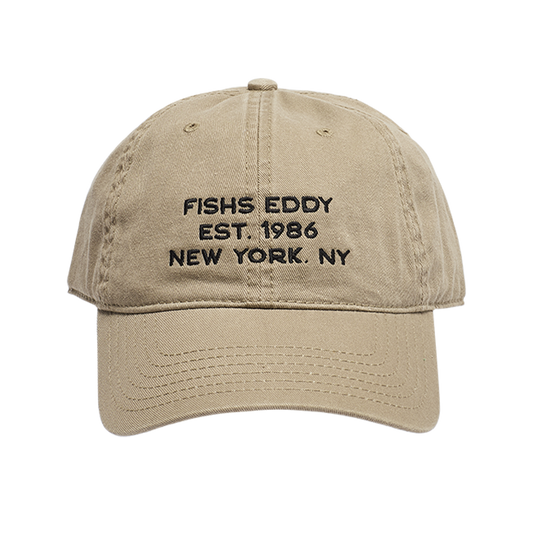 Beige cap with black text on a white background