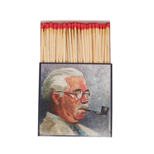 Matchbox with a portrait of a man smoking a pipe on a white background