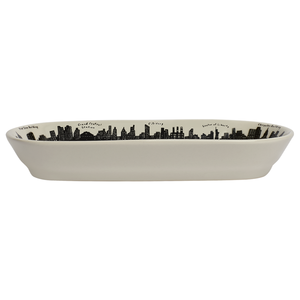 Rectangular ceramic dish with black city skyline design on a white background