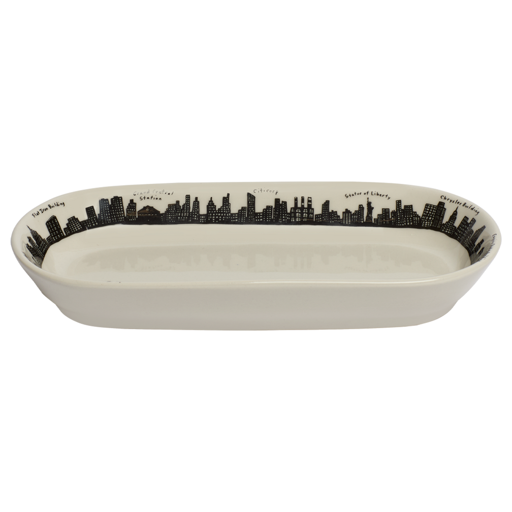 Rectangular ceramic dish with black city skyline design on a white background