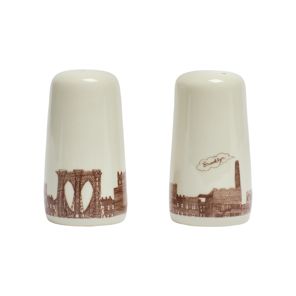 Two ceramic salt and pepper shakers with Brooklyn Bridge design on a white background