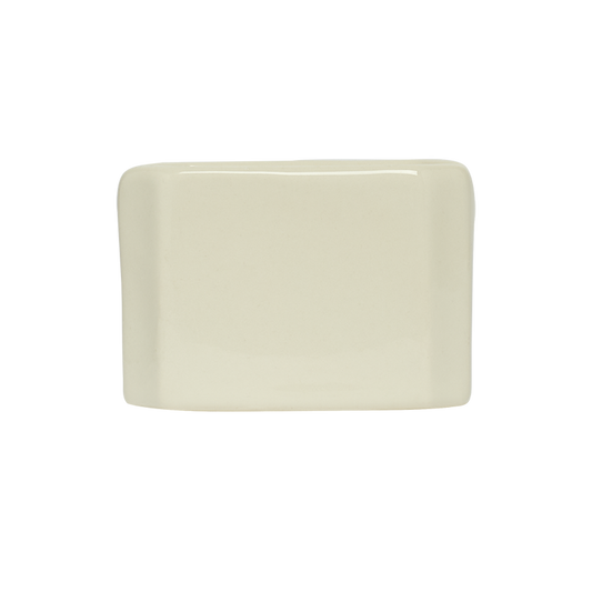 Rectangular beige ceramic plate on a white background